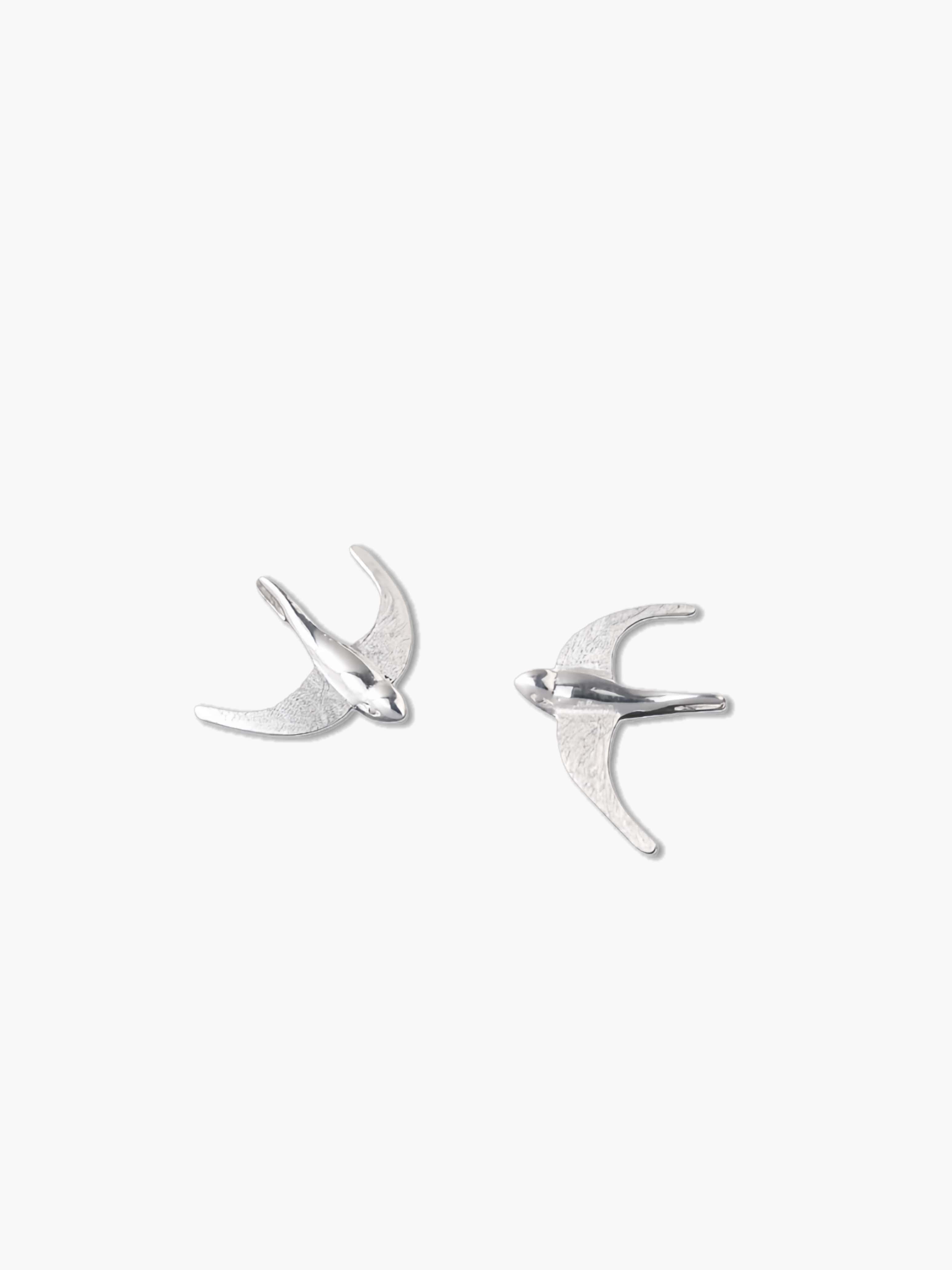 Silver bird earrings on a white background
