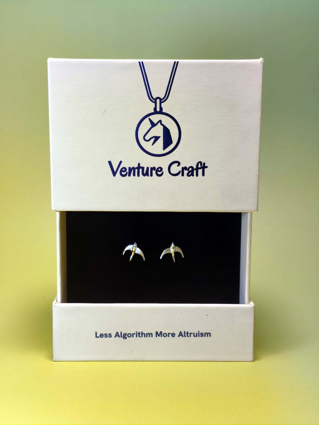 gift box of bird stud earrings with 'Venture Craft' branding on a gradient background