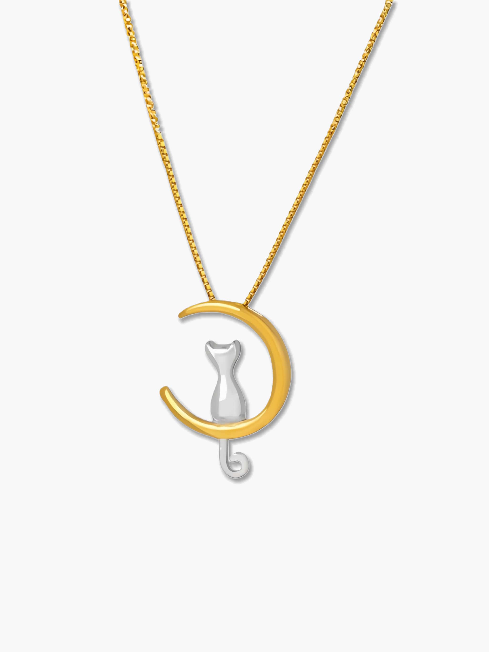 Gold and silver cat moon necklace with crescent design on a white background