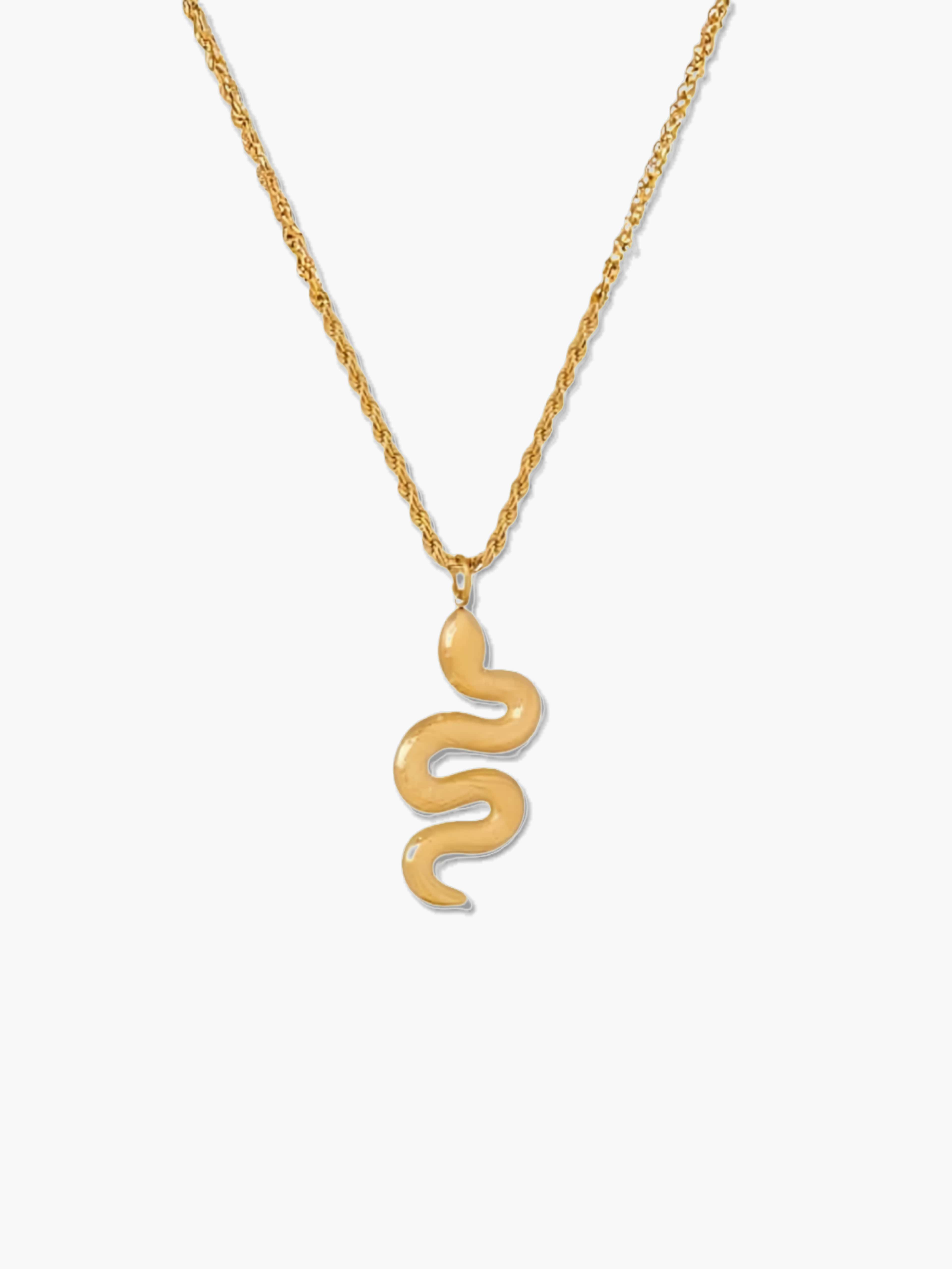 Gold snake pendant necklace on a white background