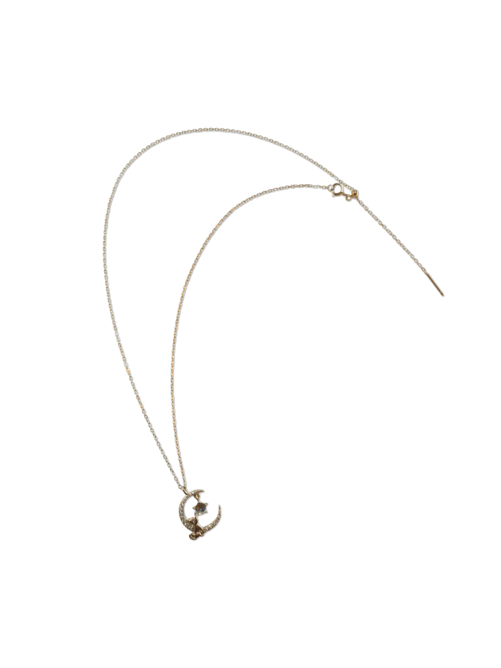 A delicate sterling silver cat necklace laid flat, highlighting the fine chain and a crescent moon pendant holding a shimmering moonstone.