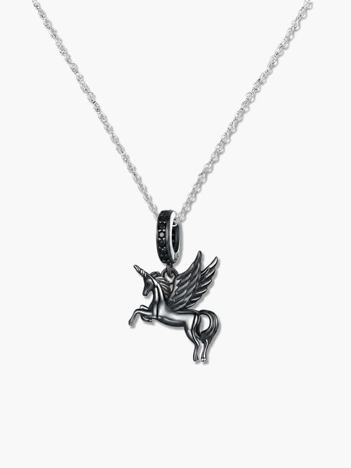 Macro studio shot of the winged unicorn necklace pendant on a white background, revealing the S925 hallmark, the sleek black rhodium plating, and the elegant black stones embedded in the bail